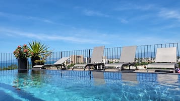 A rooftop pool, a heated pool