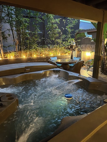 Outdoor spa tub. SoCal’s Tropical Paradise with Hot Tub