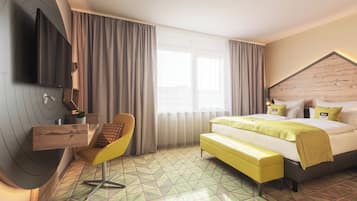 A modern hotel room with a large bed, a TV mounted on the wall, a yellow chair, and a geometric patterned floor.