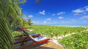 Private beach, white sand, sun loungers, beach umbrellas