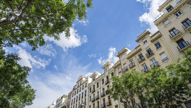 A row of multi-story buildings with balconies and windows, under a clear sky with some clouds. - COZY APARTMENT IN THE NEIGHBORHOOD OF SALAMANCA JOG48 (Madrid)
