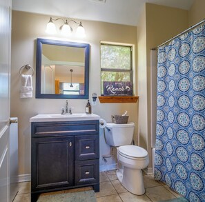 Combined shower/bathtub, hair dryer, towels, toilet paper