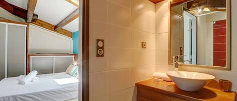 Bathtub, hair dryer, towels, soap