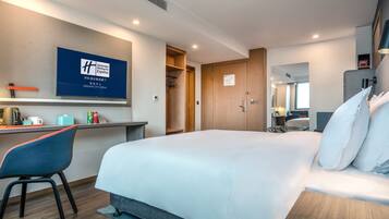 Premium bedding, down comforters, pillowtop beds, in-room safe