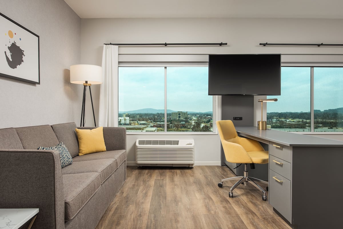 desk, laptop workspace, blackout curtains, iron/ironing board