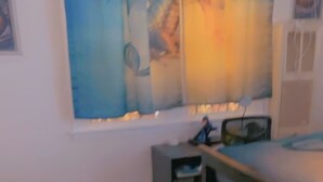 A room with a bed, a small bedside table, a large window with a view, and a blue rug on the floor. - Nice Condo for rent in Mid City LA (Los Angeles)