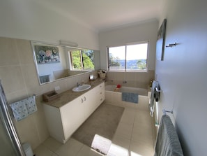 Combined shower/bathtub, hair dryer, towels, soap