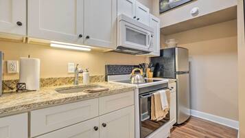 Fridge, microwave, stovetop, coffee/tea maker