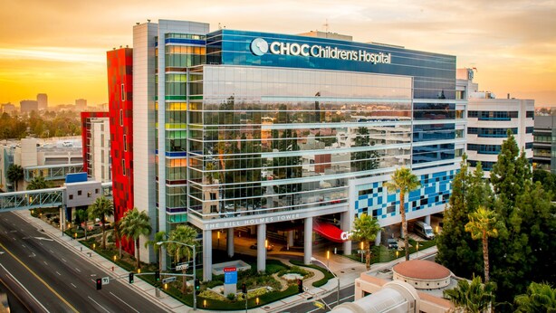 A modern building with a glass facade, labeled "CHOC Children's Hospital" and "The Bill Holmes Tower".