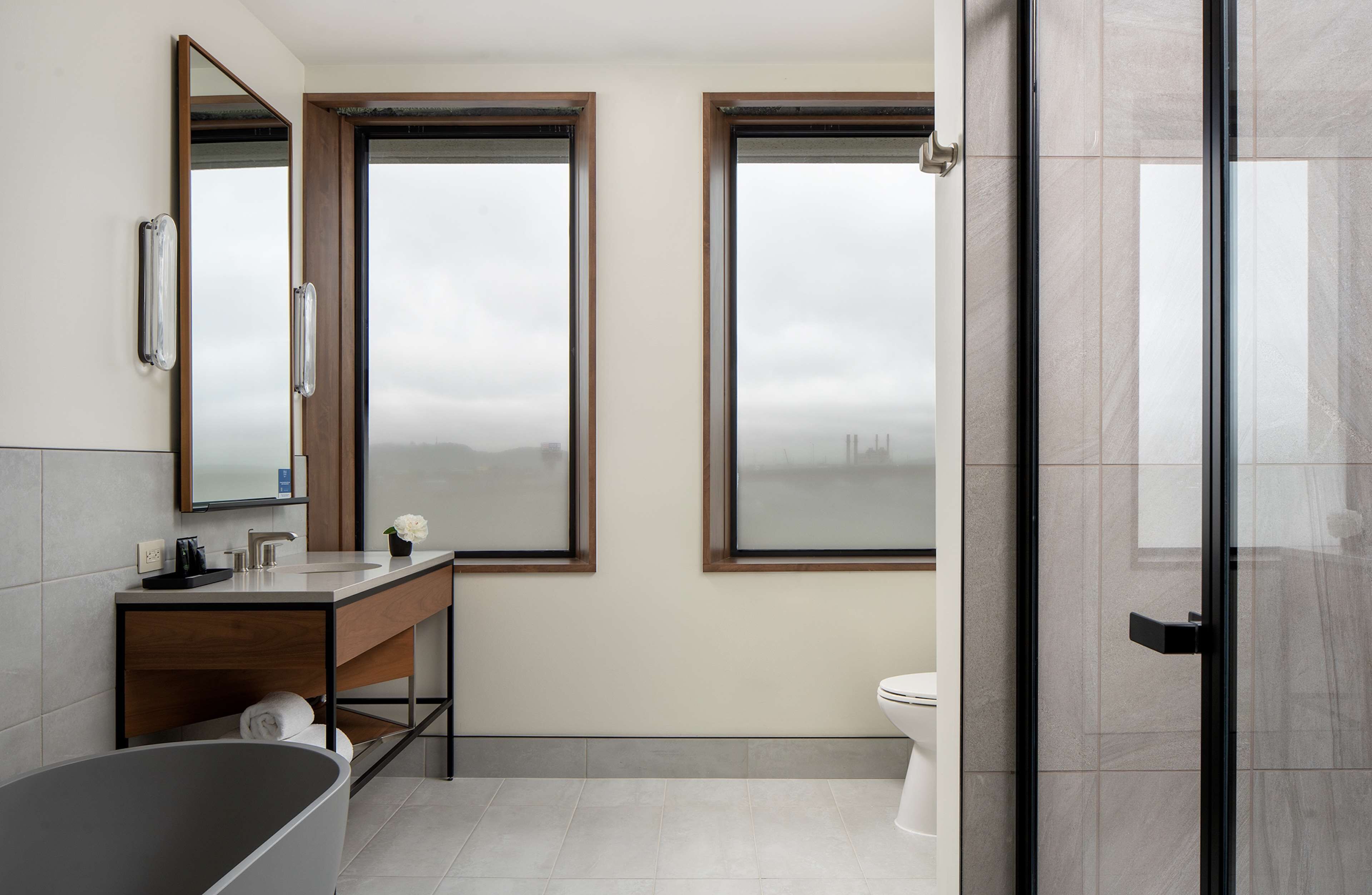 room, 1 king bed, corner (water view) | bathroom | shower, hair dryer, towels, soap