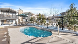 A pool area with a 3'6" depth marker, surrounded by a fence and trees. - Steps To Snowmass Base Village! Hot Tub, Pool & Mountain Access! Patio W/Grill, Covered Parking (Snowmass Village)