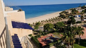 A coastal hotel with a beach view, a playground, and a parking area. - Sunny Sea View Beachfront, Wi-Fi and Air Conditioning (El Campello)