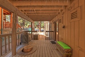A wooden deck with a bench, a covered grill, and a view of a residential area. - Walking Distance to Snow Summit Ski Resort!! Beautifully Updated 3 BED 2 BATH! Wood Burning Fireplace! Smart TVs w/ Streaming Services! (Big Bear Lake)