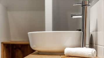 Shower, hair dryer, towels, shampoo