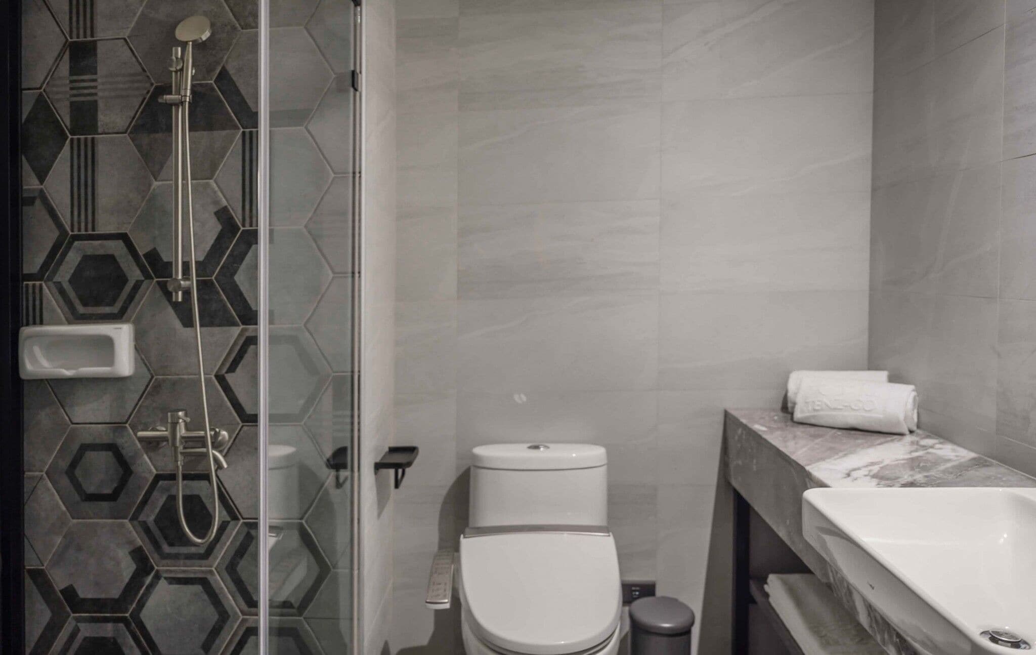 hair dryer, slippers, bidet, towels