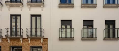 A building facade with multiple windows and balconies.
