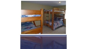 A bunk bed room with wooden frames and patterned bedding. - THE PERFECT VERMONT GETAWAY (Dover)