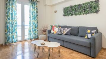 City Apartment | Living area | 40-inch flat-screen TV with satellite channels, TV