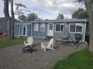 Large outdoor space for fire side or a picnic table for outdoor dining.