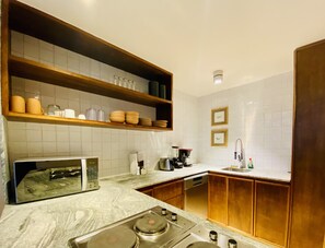 City Apartment, 2 Bedrooms | Private kitchen | Full-size fridge, microwave, cookware/dishes/utensils - 104 Luxury Aldea Zama (Tulum)