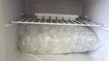 Fridge, microwave, coffee/tea maker, cookware/dishes/utensils
