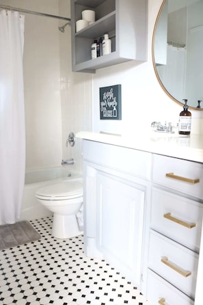 Combined shower/tub, hair dryer, towels, soap