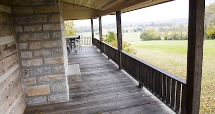 Historic Log Cabin on 200 acre farm, pasture and forest with panoramic views!