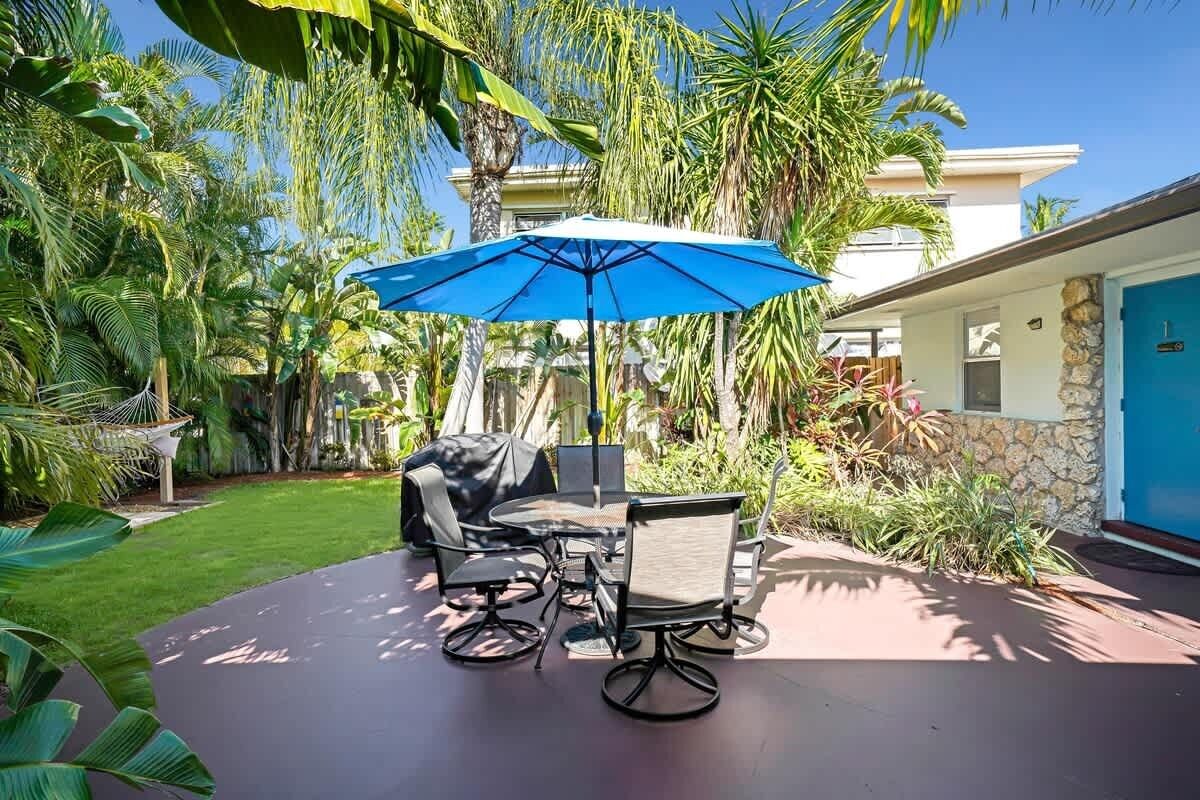 The courtyard is a shared space with outside table and BBQ grill