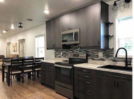 Fridge, microwave, oven, stovetop. The Oakes Oasis ~Hot Tub and Sauna~