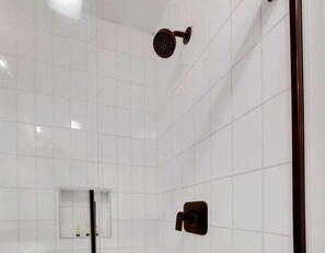 Shower, hair dryer, towels, shampoo
