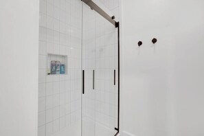 Shower, hair dryer, towels, shampoo