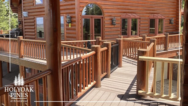 A wooden log cabin with a deck and a covered porch. - Views Galore, Spacious Luxury (Brian Head)