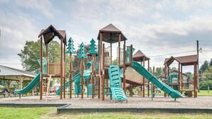 A playground with multiple slides and climbing structures. - Walk to Beach & Lake: Idyllic Escape in Edinboro! (Edinboro)