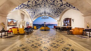 A grand lobby with a patterned floor, ornate ceiling, and a view of a cityscape. - 3 BR PENTHOUSE AT VISTA ENCANTADA RESORT RANKED #2 IN CABO SAN LUCAS (Cabo San Lucas)