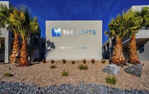 A building with a sign reading 'THE LOFTS' and an address '1122 South 1790 West'.
