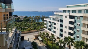 A modern apartment building with balconies overlooking a coastal area. - 2-Bedroom, Sleeps 4, Free Parking (Vlore)