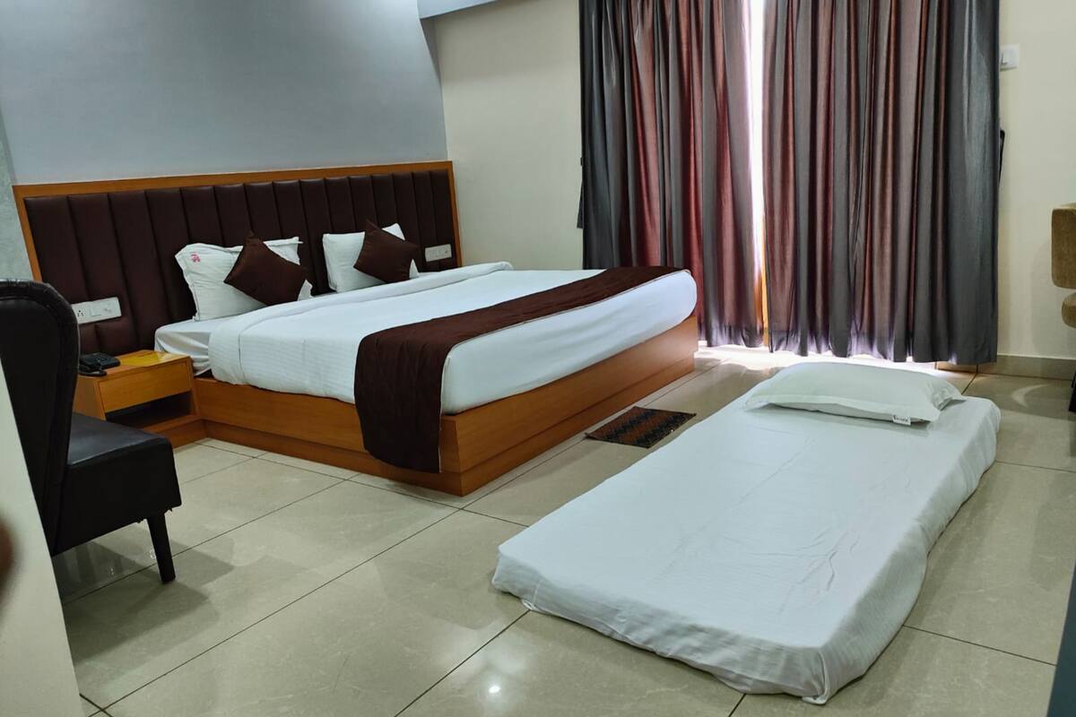 Deluxe Double Room, Multiple Beds, City View | Egyptian cotton sheets, premium bedding, down comforters