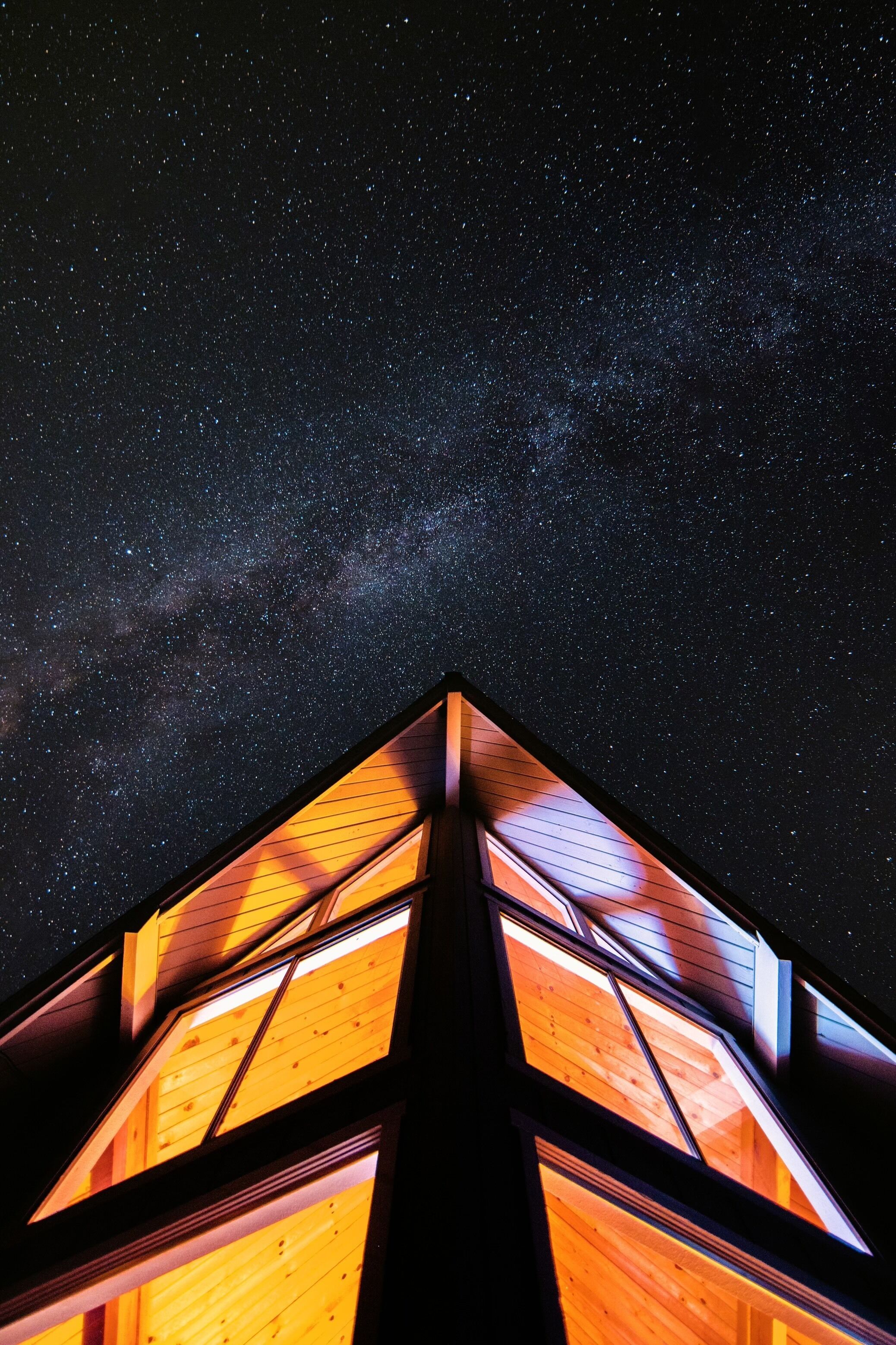 A building with a starry night sky view.