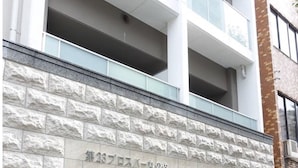 A modern building with a stone facade and large windows. - Kicon-hotels Marunouchi (Nagoya)