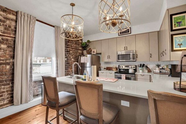 Dishwasher, coffee/tea maker, cookware/dishes/utensils