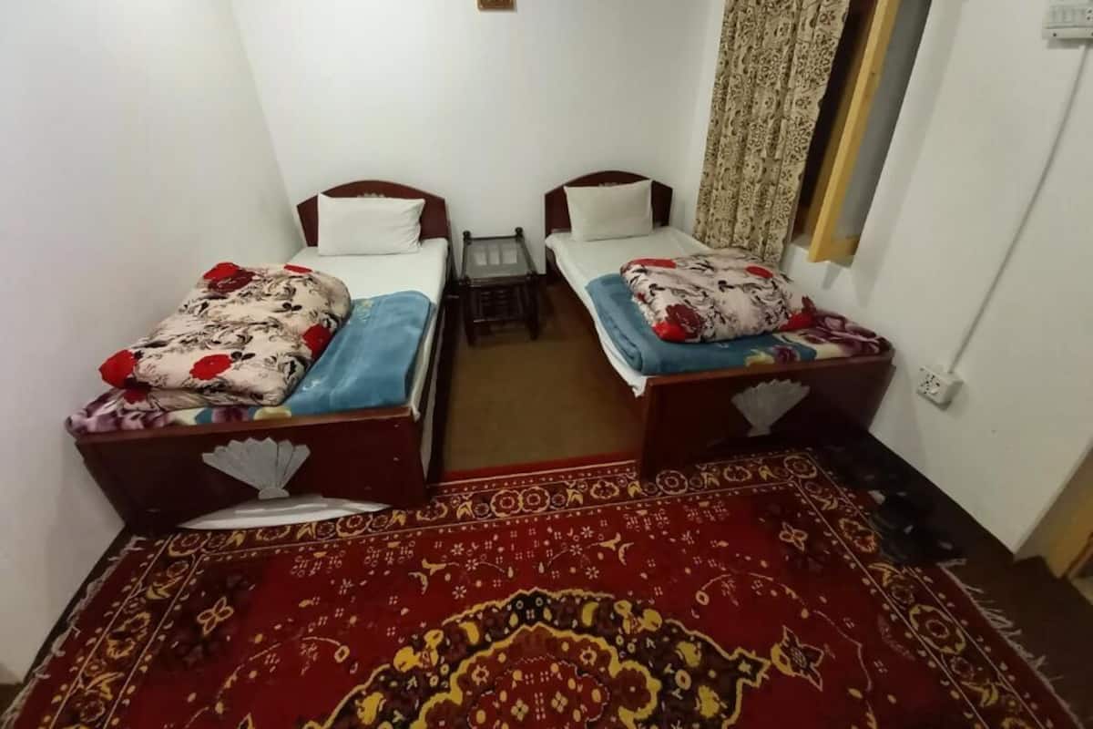 Standaard Twin kamer | Een strijkplank/strijkijzer, gratis wifi, beddengoed