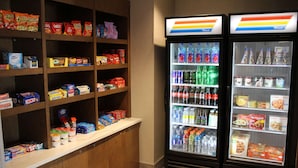 A snack and beverage vending area with various snacks and drinks. - La Quinta Inn & Suites by Wyndham Bardstown (Bardstown)