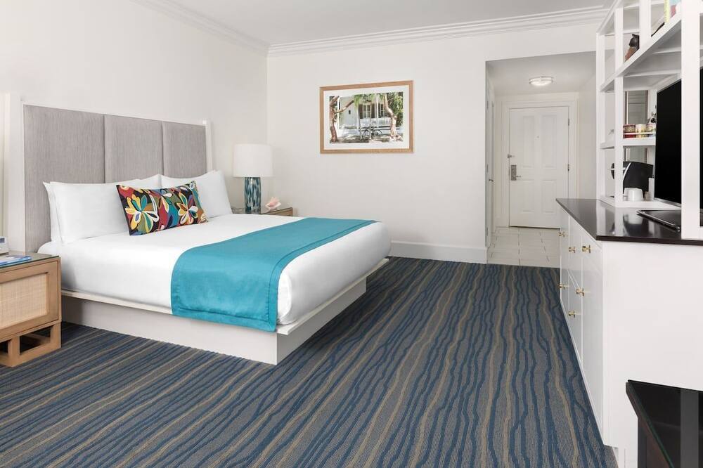 Tropical island paradise! Breathe in the ocean air from your private balcony. Step out on to legendary Duval Street, the epicenter of Key West dining and nightlife. Sip refreshing cocktails by one of three sparkling pools, and enjoy the fresh modern design of the newly built property.<br><br>ATTENTION: The Resort Fee is not included in the daily rate. A MANDATORY RESORT FEE OF $48/DAY/UNIT PLUS TAX WILL BE COLLECTED UPON ARRIVAL.<br><br>The maximum number of days that you may book per reservation is only 28 days.<br><br>The listing is distributed and managed by RoomPicks Accommodations.<br> <br>THE UNIT<br><br> This 400sf unit features:<br>- 1 King bed;<br>- Balcony;<br>- Daily Housekeeping<br>- Minibar, coffee maker;<br>- All linens, towels, bathroom essentials are provided!<br> <br>THE PROPERTY<br><br>Enjoy access to all the resort amenities including:<br>- 24/7 front desk and security;<br>- 3 swimming pools;<br>- Pool loungers, umbrellas and towels;<br>- Fitness center;<br>- On-site restaurant with Latin cuisine;<br>- Tiki bar and poolside beverage service;<br>- Bicycle rentals;<br>- Parking ($30/night)<br>- Pets allowed for an extra charge of $75 per day. Tropical Getaway! 3 Pools, On-site Restaurant, Bike Rental, Pets Allowed!