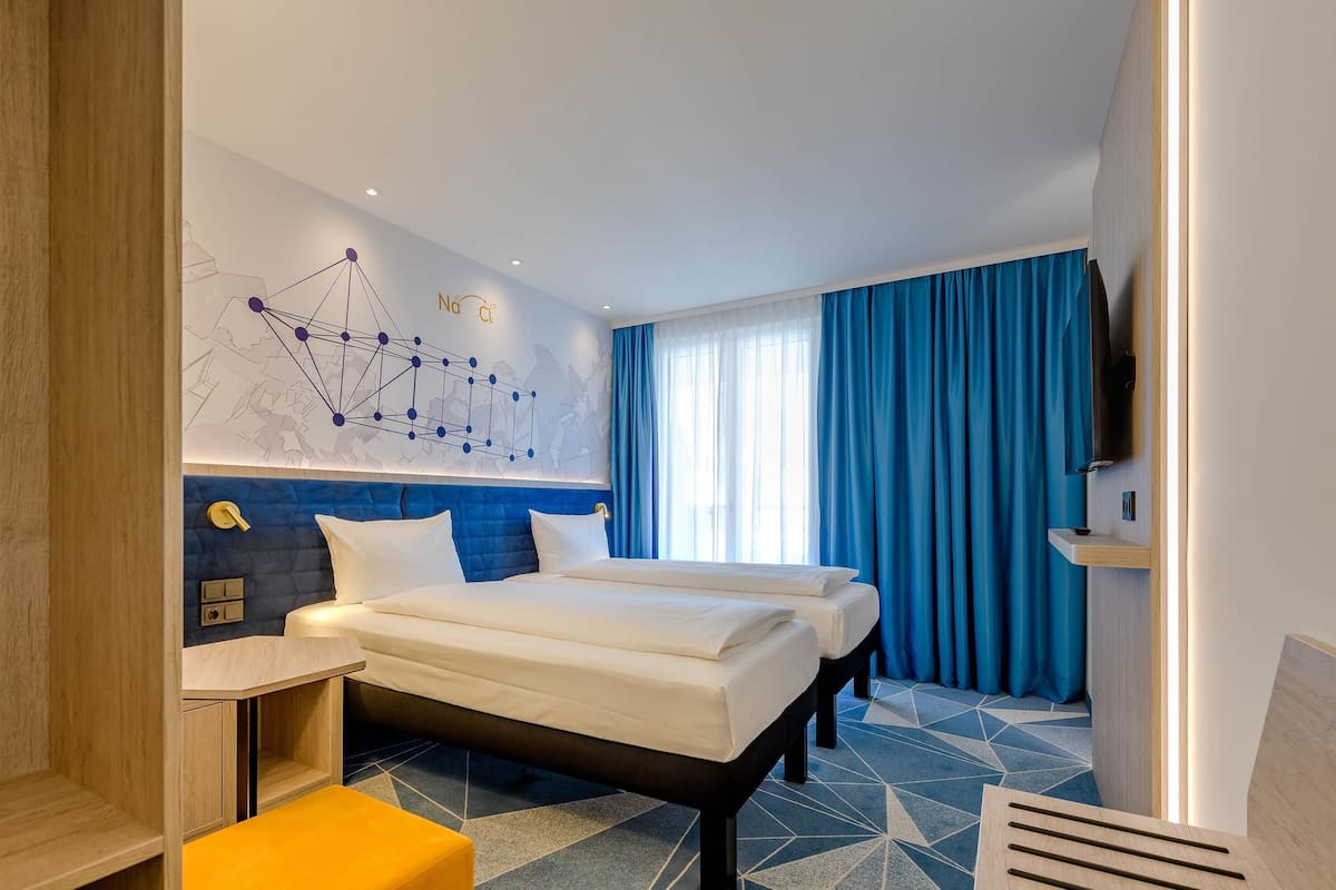 Hypo-allergenic bedding, desk, blackout drapes, soundproofing