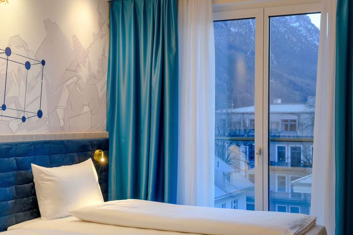 hypo-allergenic bedding, desk, blackout curtains, soundproofing