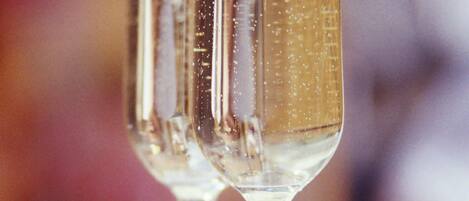 A close-up of a champagne glass with bubbles.