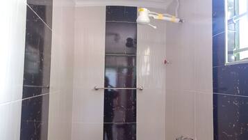 Shower, towels, soap, toilet paper