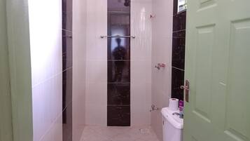 Shower, towels, soap, toilet paper