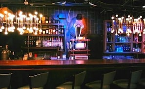 Enjoy a casual drink at the bar, where a bartender is always ready to serve.