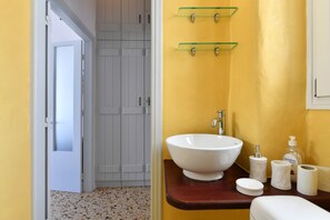 Apartment | Bathroom | Shower, hair dryer, slippers, towels - Kastro Traditional House (Paros)